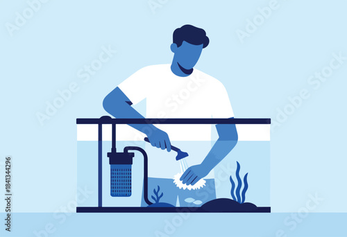Man cleaning an aquarium with a brush and hose