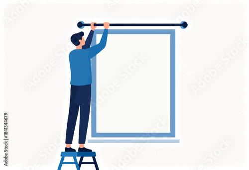 Person on stepladder hangs display on wall