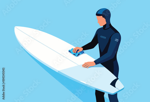 Surfer in wetsuit cleans white board with blue cloth on clear blue background