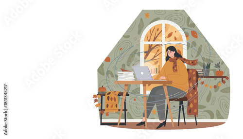 Woman working on laptop in cozy autumn home office with falling leaves