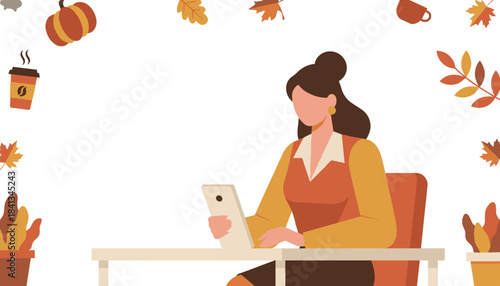 Businesswoman working on tablet at desk with coffee and autumn seasonal elements