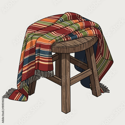 Colorful striped woven blanket draped over a rustic wooden stool on a neutral background