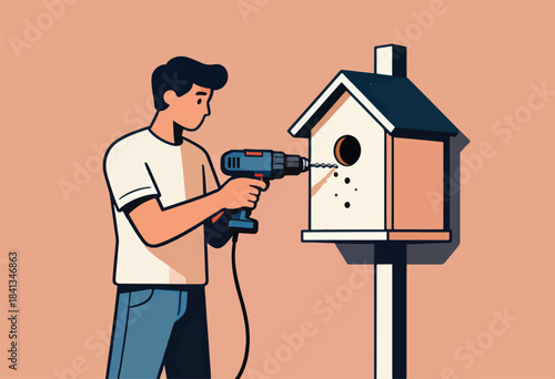 Man uses drill to make holes in a wooden birdhouse on a pole