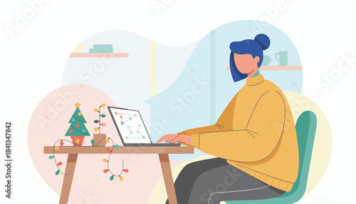 Woman working remotely on laptop during Christmas holidays with festive desk decorations