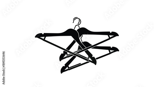 Black clothing hangers crossed stacked together organized fashion storage solution