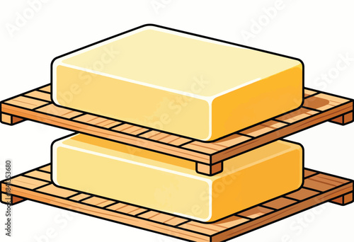 Two yellow blocks of cheese stacked on wooden pallets