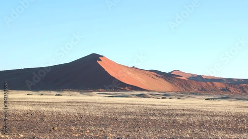 a zoom in shot of a sand dune at sunrise at sossusvlei in namibia, africa