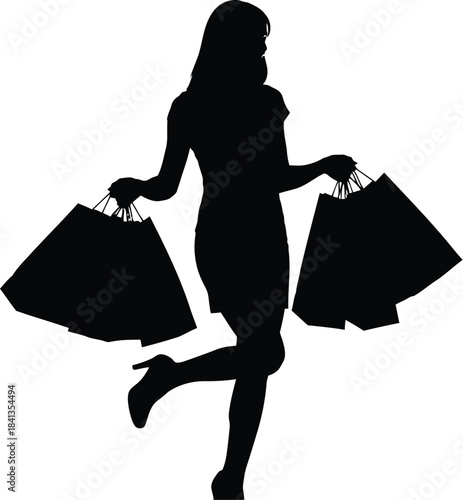 Silhouette of a happy woman with shopping bags