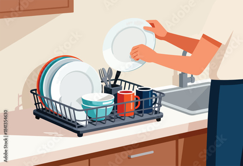 Hands place clean plate in drying rack beside washed dishes and mugs