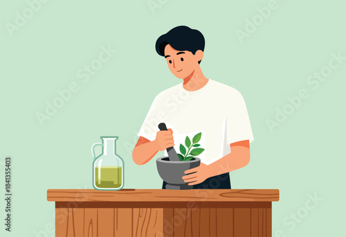 Man grinding herbs in a mortar with a bottle of oil nearby