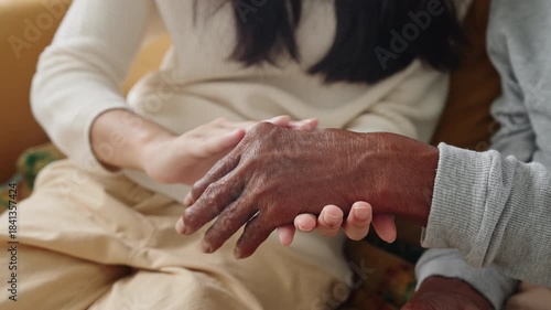 Close-up.Hand granddaughter physical therapy with finger massage grandfather, for aches pains at home