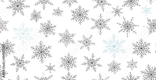 A detailed pattern of various sized editable snowflakes on a white background.