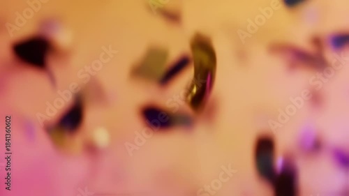 Abstract confetti fall on a colorful background, ideal for party celebrations