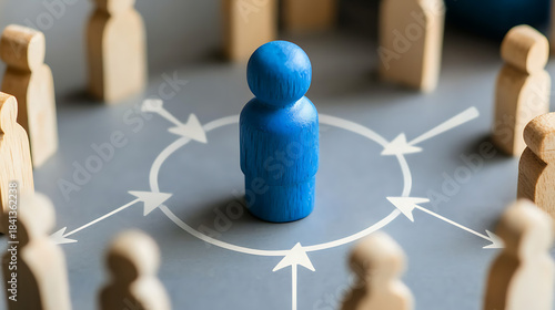Leadership concept: a blue wooden figure stands out among wooden figures, symbolizing influence, strategy, and the leader's role within a group of people. Spotlight effect.