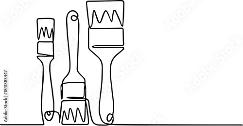 Continuous one-line drawing of a set of three different paintbrushes with varying sizes and brush heads.