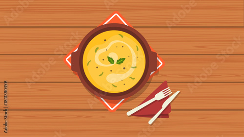 A Bowl of Delicious Creamy Soup Garnished with Fresh Basil Leaves, Served on a Wooden Table with Cutlery, Ready to Be Enjoyed