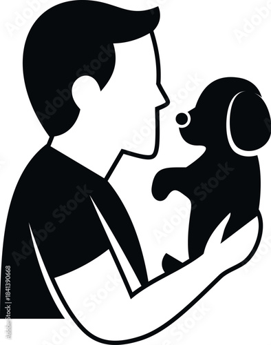 Man holding puppy, showing affection and a strong bond with his pet