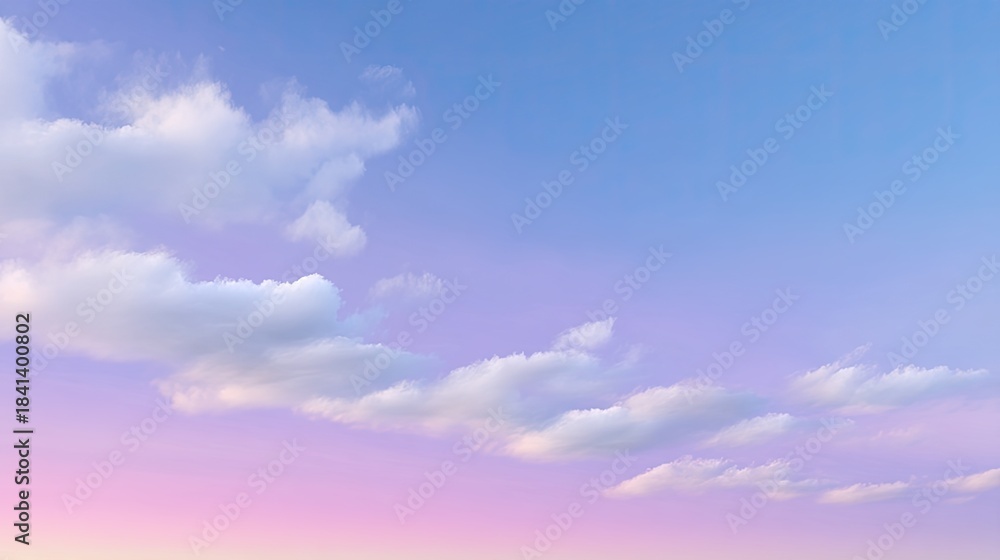 Fototapeta premium Serene Sky with Soft Clouds Above a Gradient Horizon at Dusk, Capturing the Tranquility and Beauty of a Colorful Twilight Sky