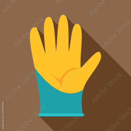 Yellow and blue cleaning glove with long shadow on brown background