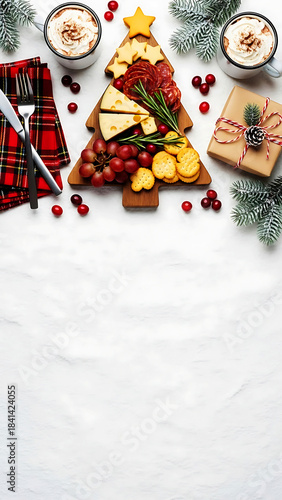 Festive christmas charcuterie board with cheese meats and holiday decorations displayed