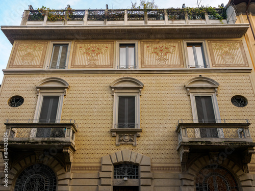 Old residential building along Via Gherardini in Milan, Italy