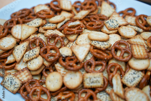 pretzels and biscuits placed on a plate. detail.