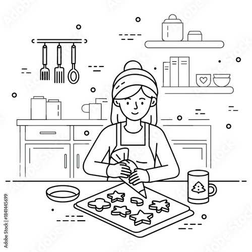 Young caucasian female decorating christmas cookies in kitchen