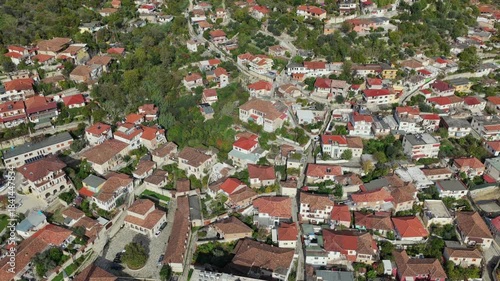 Aerial view of Berat’s hillside homes, showcasing traditional stone houses, tiled roofs, and the historic townscape below.
