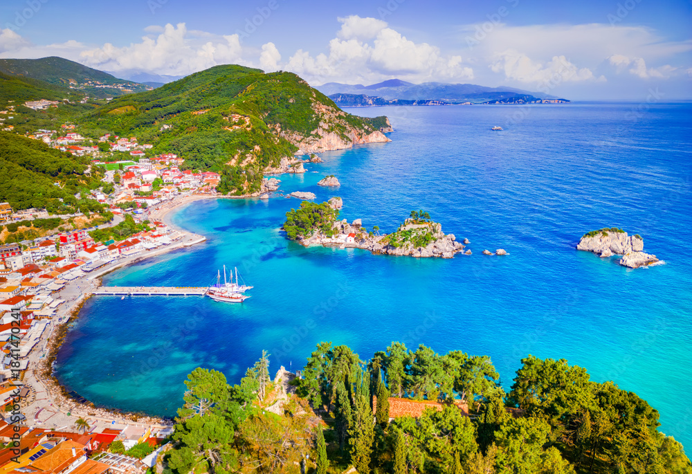 Fototapeta premium Parga, Greece. Aeriual drone view of beautiful colorful coastal town in Epirus, Greek holidays.