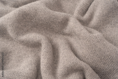 Soft grey merino wool sweater texture as a background.