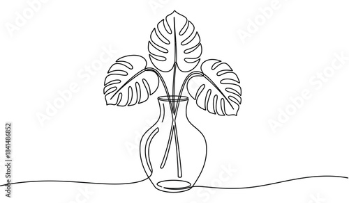 Monstera leaf sketch in decorative glass bottle