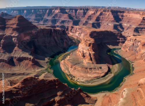 Scenic view of a horseshoe bend river winding through a red rock canyon. Nature landscape for travel inspiration and adventure tourism.