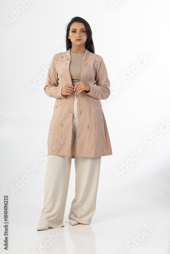 Beautiful woman wearing professional medical healthcare lab coat in studio photography