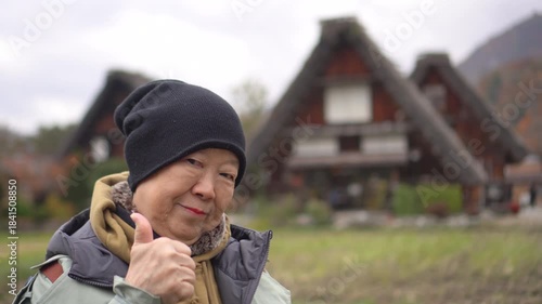 Asian senior woman travel at Shirakawa-go Gifu Japan happy tourist
