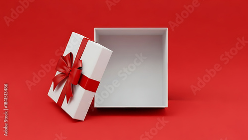 an open white gift box with a vibrant red ribbon and bow is positioned against a solid red background creating a festive presentation high quality professional