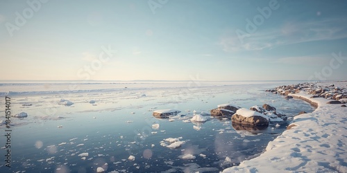 Fototapeta Naklejka Na Ścianę i Meble -  Icy sea beach with first ice pieces in Baltic Sea, highlighting seasonal change