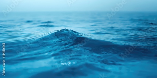 Fototapeta Naklejka Na Ścianę i Meble -  Calm blue ocean waves in a soothing seascape, ideal for background use, Earth Day
