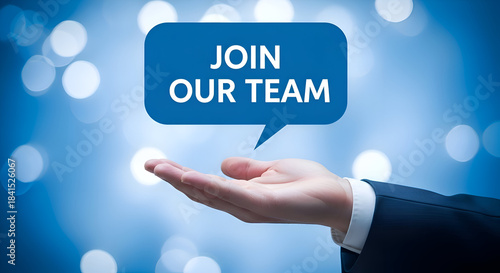 Open hand presenting a bright blue speech bubble with the words join our team against a soft bokeh background symbolizing recruitment opportunity