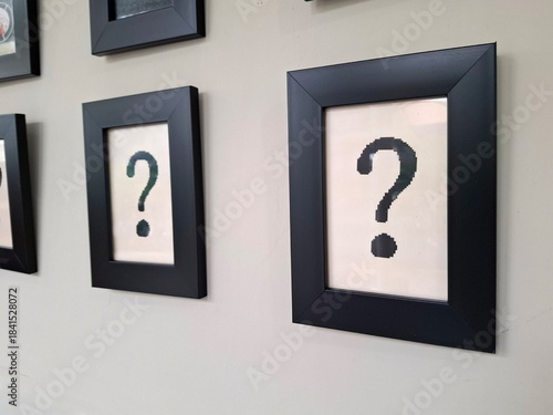 Question mark wall decoration hanging on a wall.