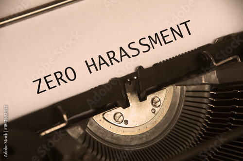 Side view of Zero Harassment text on an old typewriter in vintage color