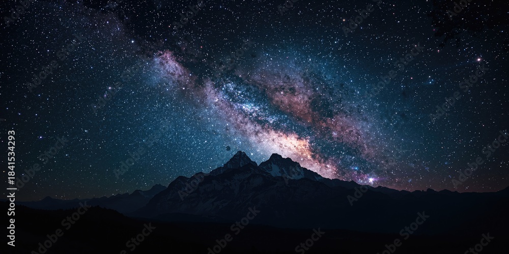 Obraz premium Nighttime scene of mountains with a star-filled sky, ideal for use as a UI backdrop or visual separator