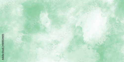 Green watercolor background with marbled grunge texture and color splash design,  Light green background. White a Christmas green backgrounds or papernd green watercolor grunge texture background. Sky