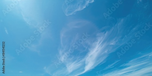 Fototapeta Naklejka Na Ścianę i Meble -  Blue sky background with light clouds used as a background for text or layout design, suitable for editorial headers