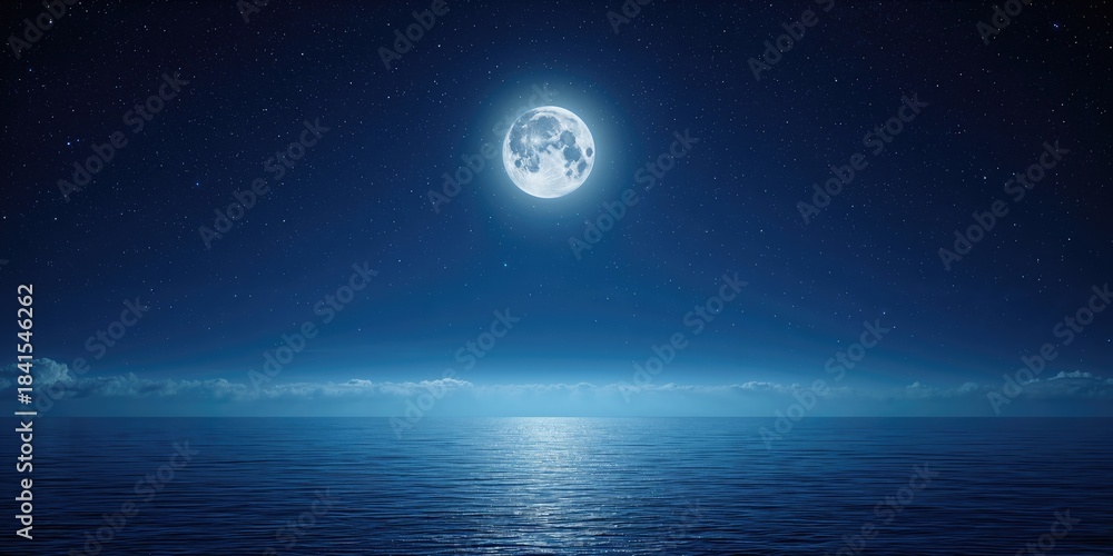 Obraz premium Full moon over water illuminating a night landscape with a dark blue starry sky, natural night scenery
