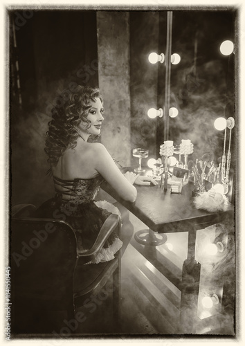art photography sepia black and white color retro lady sits at makeup table looking into mirror with vintage lamps dressing room, sexy woman burlesque show cabaret dancer actress flapper girl 20s roar
