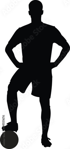 Silhouette of a soccer player with one foot on a soccer ball