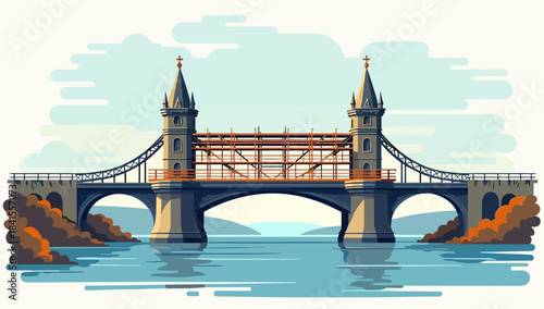 Historic old bridge scaffolded for repair with twin towers over reflective water