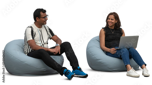 Two people sitting on bean chairs and talking and working with laptop, isolated on white and transparent background
