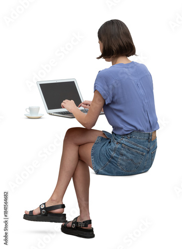 Valokuva Woman sitting on an invisible chair seen from back angle and working with a comp