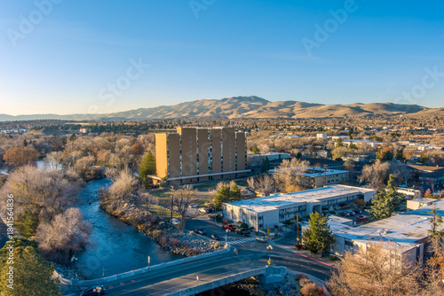 Aerial view of Reno Nevada looking Northwest from downtown with the Truckee River a residential area and Peavine mountain in the distance during late autumn
